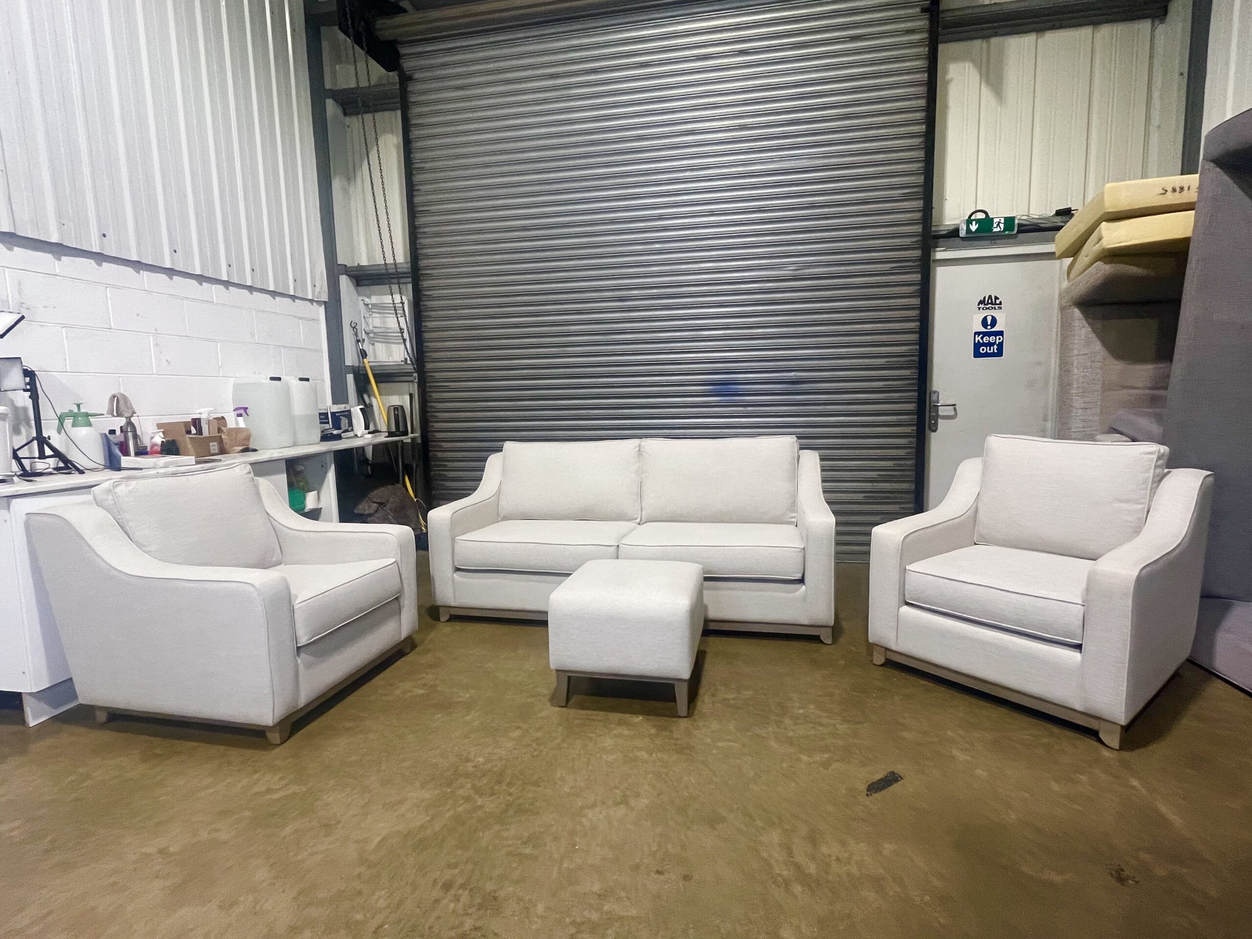 Light Beige 3 seater sofa with two matching armchairs & footstool.